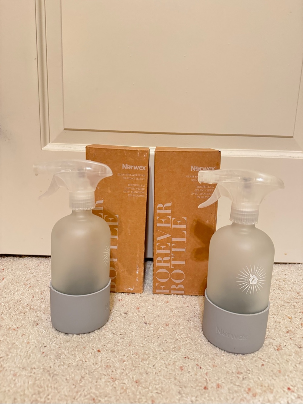 Norwex Frosted Glass Spray Bottles with Light Gray Silicone Bases